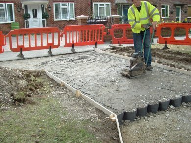Geocell filled with angular stone for a tree root protection drivway project