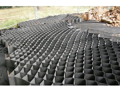 Road embankment with geocell ersion control cells applied